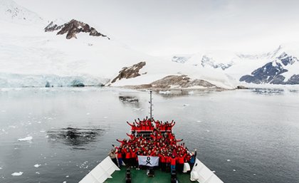 Scientists-on-bow-of-ship-in-Antarctica